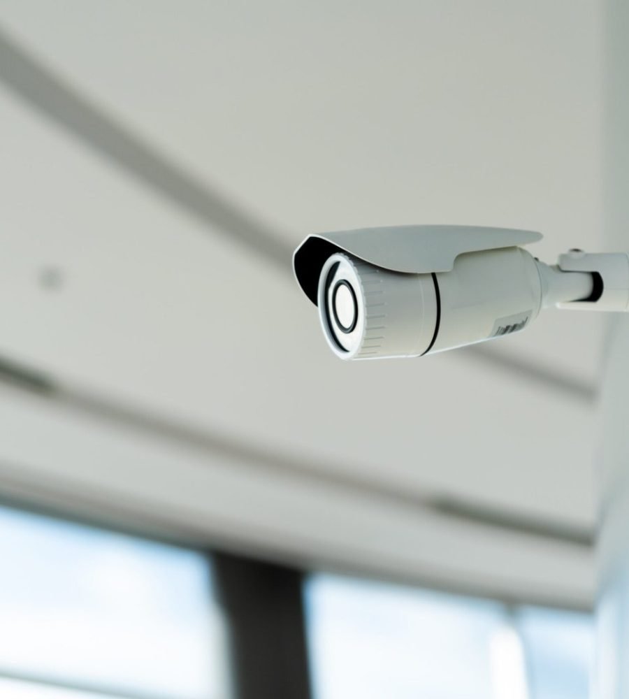 security-white-cctv-closed-circuit-television-camera-office-building-scaled.jpg